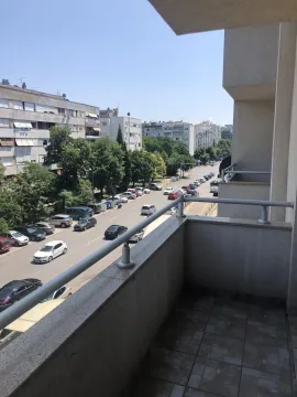 View from the balcony overlooking the street and buildings. - image 21