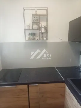 Part of the kitchen with countertop, sink and wall shelf. - image 4