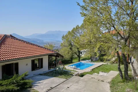 Exterior of the house with a swimming pool, yard, and mountain view. - image 4