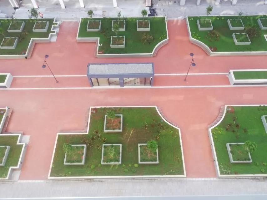 Overhead view of a landscaped shared courtyard with green areas.
