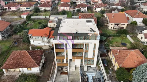 Aerial view of a residential building under construction with surroundings. - image 2