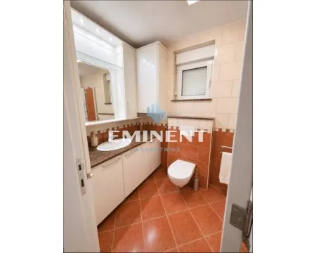 Bathroom with a sink, built-in cabinets, and a toilet. - image 12