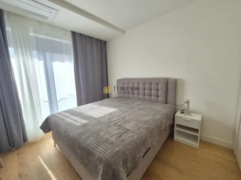 Bedroom with a double bed and a nightstand. - image 6