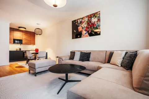 Living room with sofa and dining area in the background. - image 8