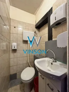 Smaller bathroom with a sink and a toilet. - image 10