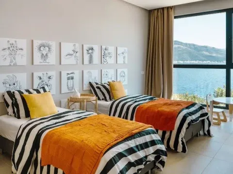 Children's bedroom with two beds and a sea view. - image 4