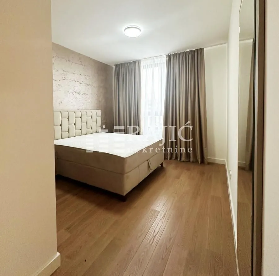 Furnished bedroom with a double bed.