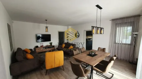 Spacious living room with a dining area and modern furniture. - image 8