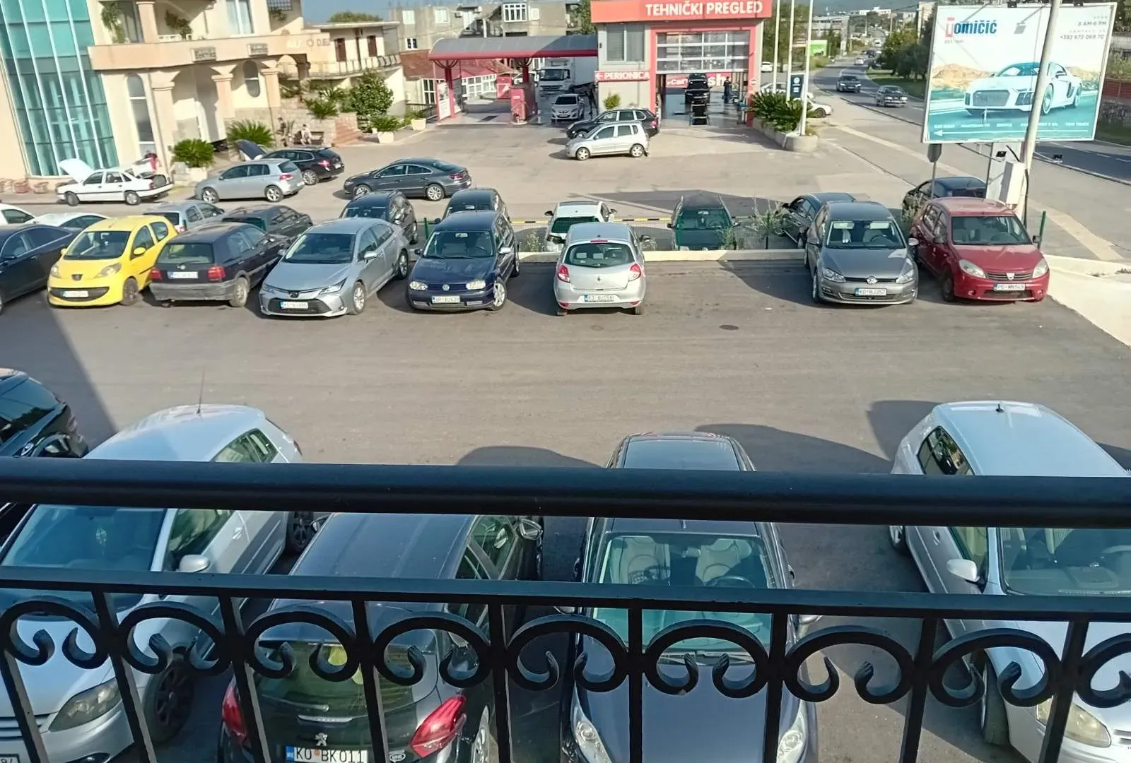 View from the terrace overlooking the parking lot and surrounding buildings.
