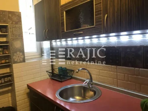View of a section of the kitchen with a sink and wall cabinets. - image 12