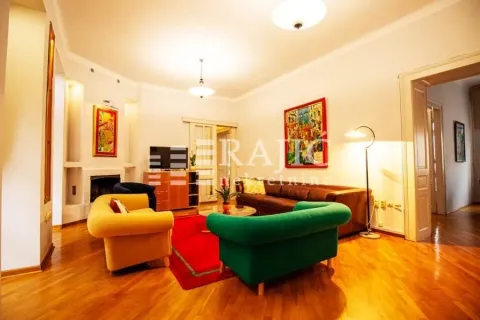 Spacious living room with seating furniture and parquet flooring. - image 3