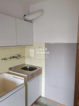 Small kitchen with a sink and wall cabinets in original condition. - image 6