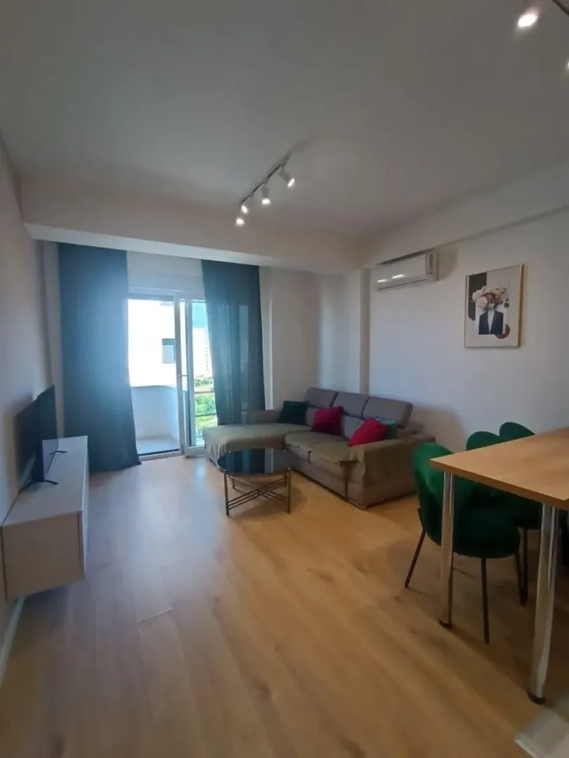 Spacious living room with a sofa set and dining table.