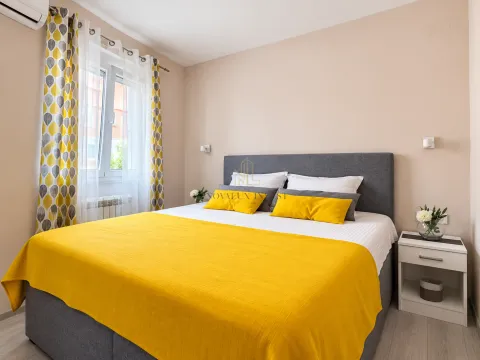 Comfortable bedroom with a double bed and a nightstand. - image 12