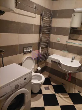 Bathroom equipped with sanitaryware, washbasin, toilet bowl and washing machine. - image 5