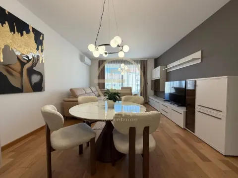 Living room with a dining area and modern furniture. - image 2