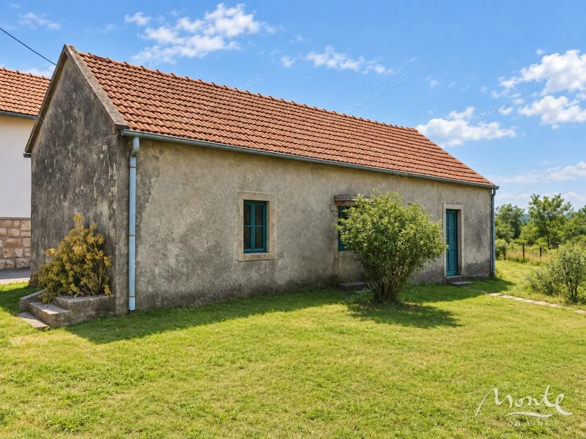 View of an older single-story house with a grassy yard.