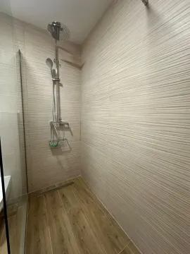Modern walk-in shower cabin with a built-in drain and shower system. - image 15