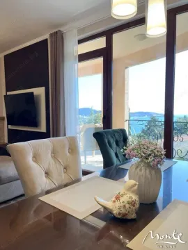 Living room with a dining table and a sea view. - image 16