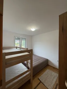 Bedroom with a bunk bed and an extra mattress. - image 7