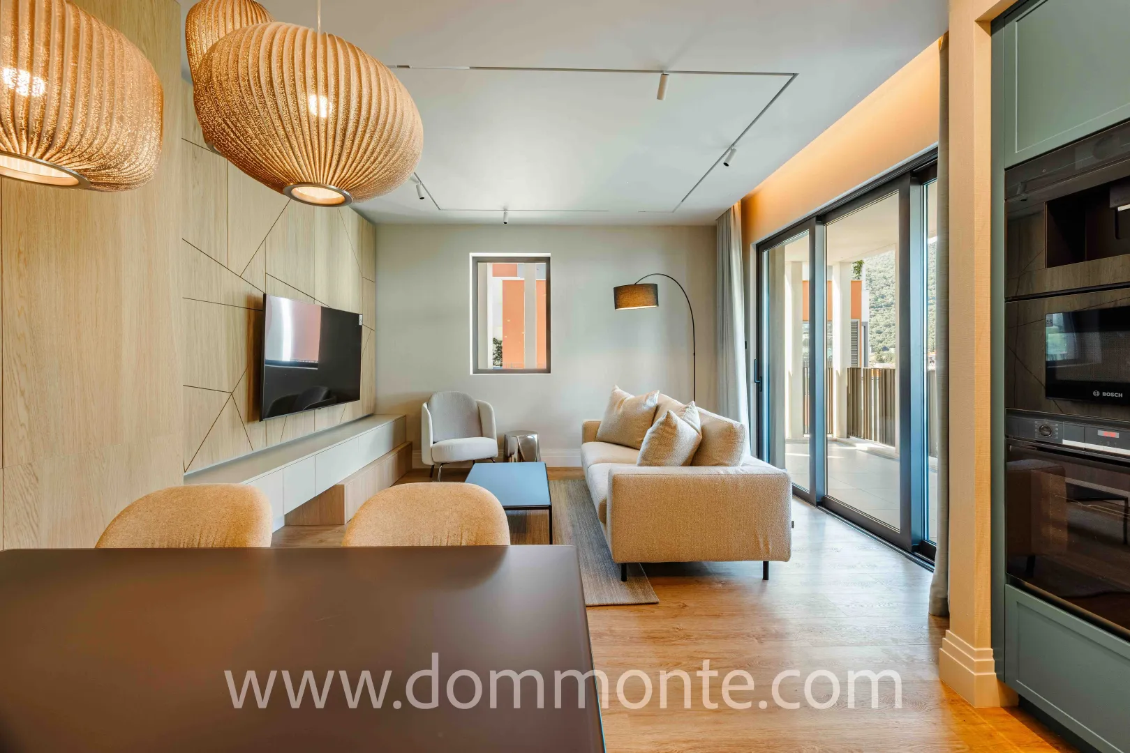 Modern living room connected with the dining area and kitchen.