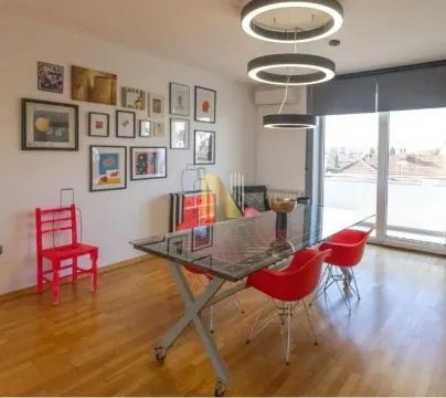 Spacious dining area with a modern table and chairs, decorated with wall art. - image 3