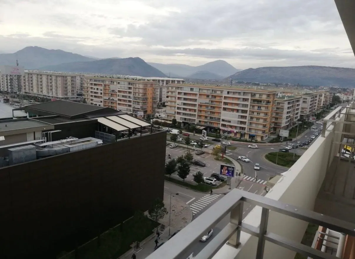 View from the terrace overlooking the city neighborhood and surrounding mountains.