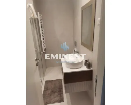 Smaller bathroom with a walk-in shower and a washbasin. - image 3
