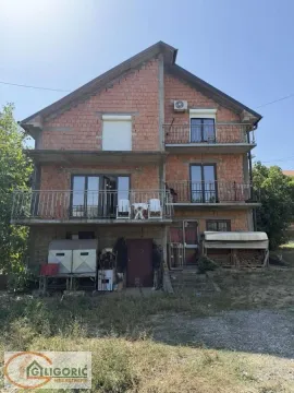 View of the facade and yard of a two-story house under construction. - image 4