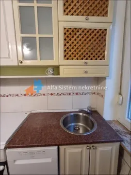 Part of the kitchen with a sink and wall units. - image 17