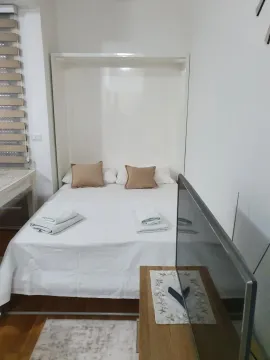 Small bedroom with a double bed and a TV. - image 5