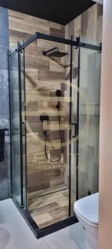 Modernly equipped bathroom with a shower cabin. - image 10