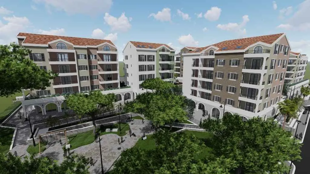 Arhitektonski vizuelni prikaz stambenog kompleksa sa uređenim dvorištem.