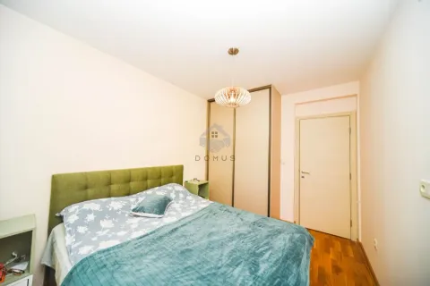 Bedroom with a double bed, wardrobe, and a door. - image 6