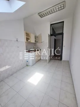 Smaller kitchen with white units and ceramic floor tiles. - image 7