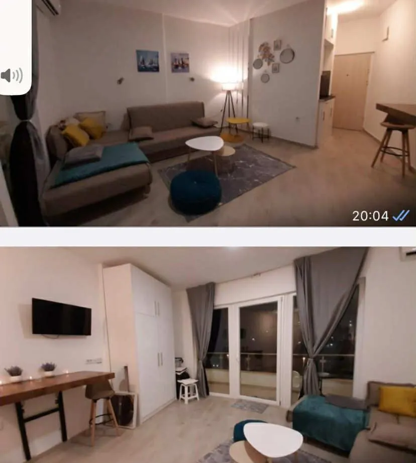Living room with a sofa and dining area.