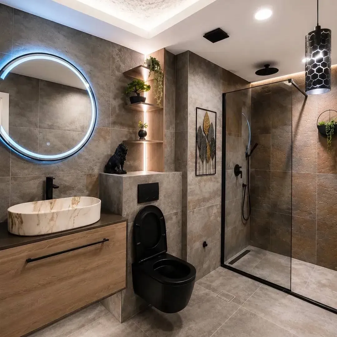 Modernly decorated bathroom with a walk-in shower, basin, and black sanitaryware.
