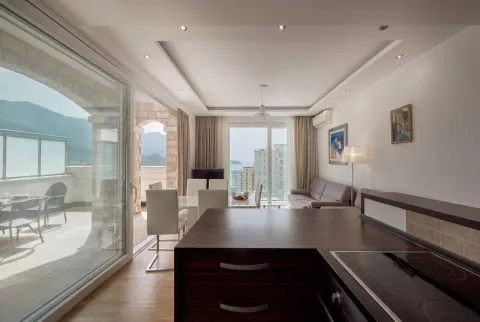 Living room connected to the dining area and kitchen, with access to the terrace. - image 10
