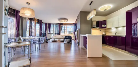 Spacious living room with a dining area and modern kitchen. - image 4