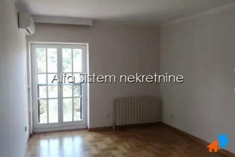 Empty room with parquet flooring and balcony doors. - image 6