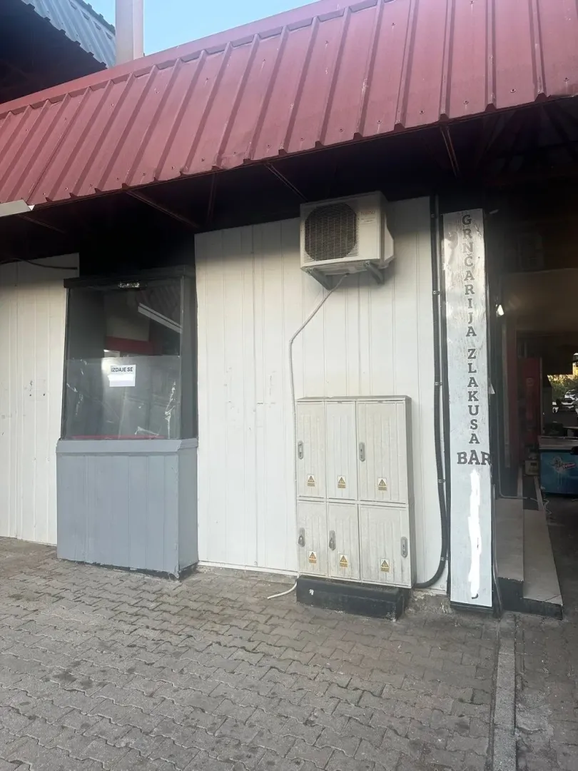 Exterior view of the commercial space with a canopy and entrance.