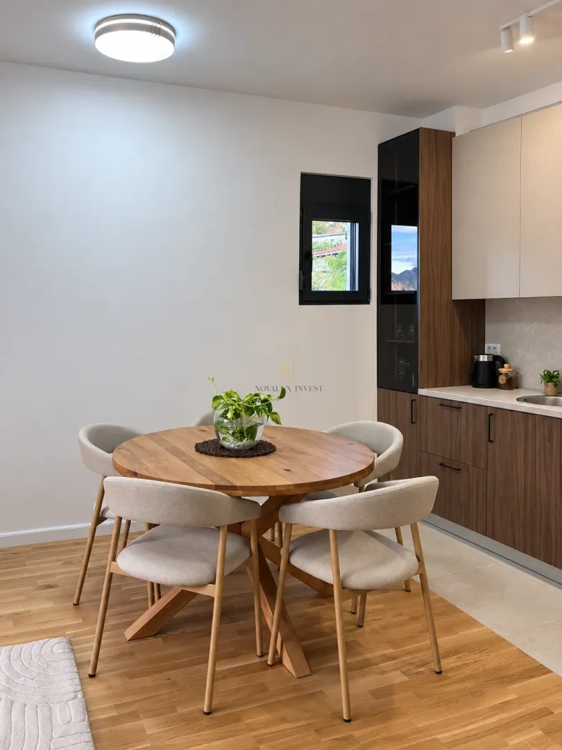 Dining table with chairs in a modern kitchen.
