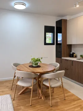 Dining table with chairs in a modern kitchen. - image 6