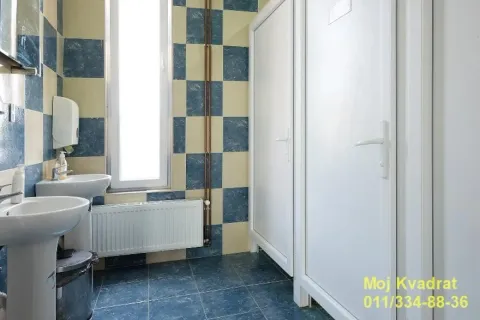 Bathroom with two sinks and cabins. - image 14