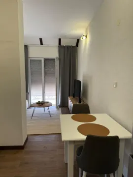 Living room with dining area and access to the terrace. - image 4
