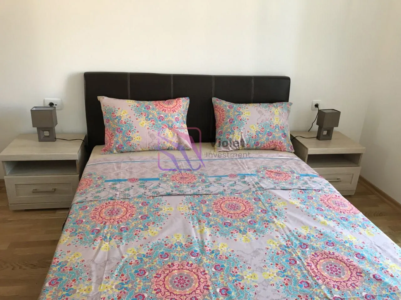 Furnished bedroom with a double bed and two nightstands.