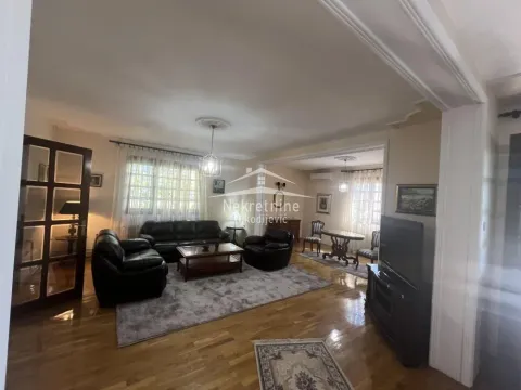 Spacious living room with seating set and dining area in the background. - image 10