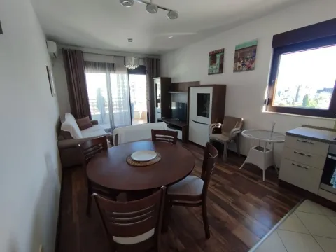 Living room with dining area and kitchen in an open space layout. - image 2