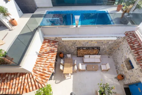 Courtyard with seating furniture, dining table and a swimming pool on the upper level. - image 17