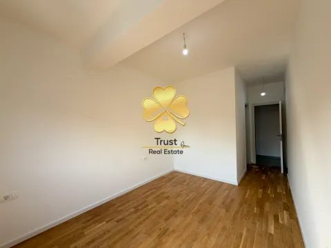 Empty room with wooden flooring and an agency watermark. - image 6